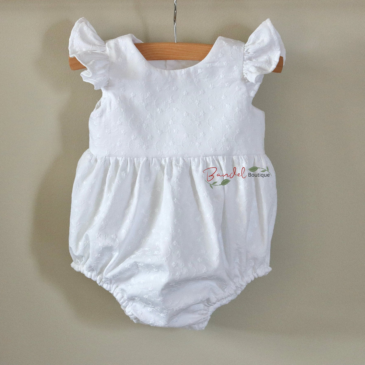 White Embroidery Cotton Baby Romper, features flutter sleeves, elastic at the legs opening, wooden buttons at the back and snaps at the crotch, perfect for christening or baptism outfit.