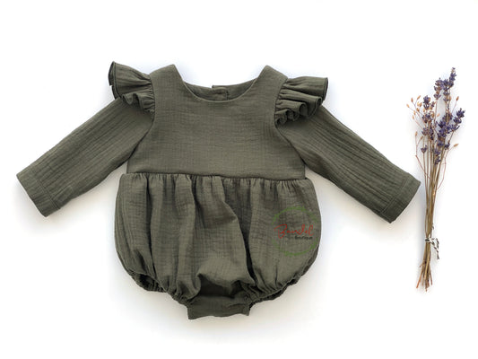 Muslin Bubble Playsuit is the perfect addition to any eco-friendly baby's wardrobe. Crafted from sustainable muslin, this khaki-green romper features full length flutter sleeves, elastic at the legs, and wooden buttons down the back and snaps at the crotch. Keep your baby comfortable and stylish with this sustainable playsuit.