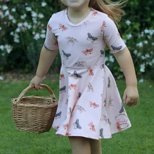 This cute butterfly Twirly dress is a timeless and elegant garment for your little girl. Crafted from comfortable and soft organic cotton, it features a slim fit with a vintage length that falls just above the knee. The butterflies print and slim long/ short sleeves will be the perfect finishing touches for any outfit.