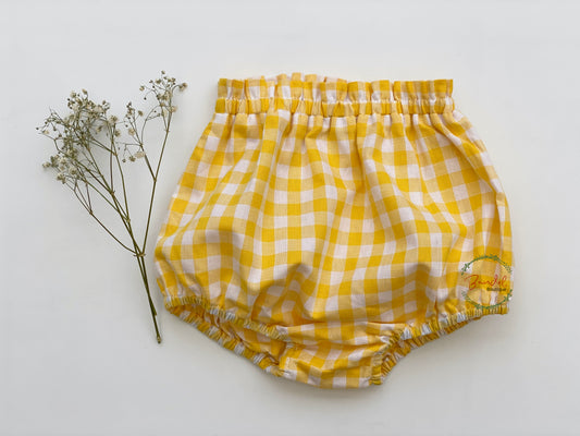 Yellow gingham cotton baby toddler bloomers.Timeless yellow check cotton features frills details at the waist and elastic waistband and at the legs for the perfect fit.