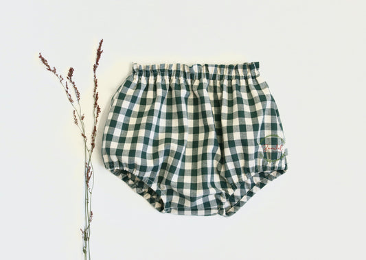  Green Checked Bloomer Diaper cover short Cotton is perfect for your little one. Crafted from bottle green checked cotton, it features frills detail at the waist and comes with an elasticated waistband and legs for a snug fit. 
