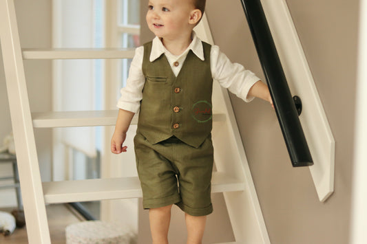 Sage-Green Pageboy Outfit is the perfect combination of comfort and sophistication. The shorts are tailored to fit with two side pockets and an elasticized back waistband for flexibility. The vest features front wooden buttons and a welt pocket for added utility. Accompanied with an ivory shirt with a collar and three-quarter sleeves, this outfit is ideal for any formal or semi-formal occasion.
