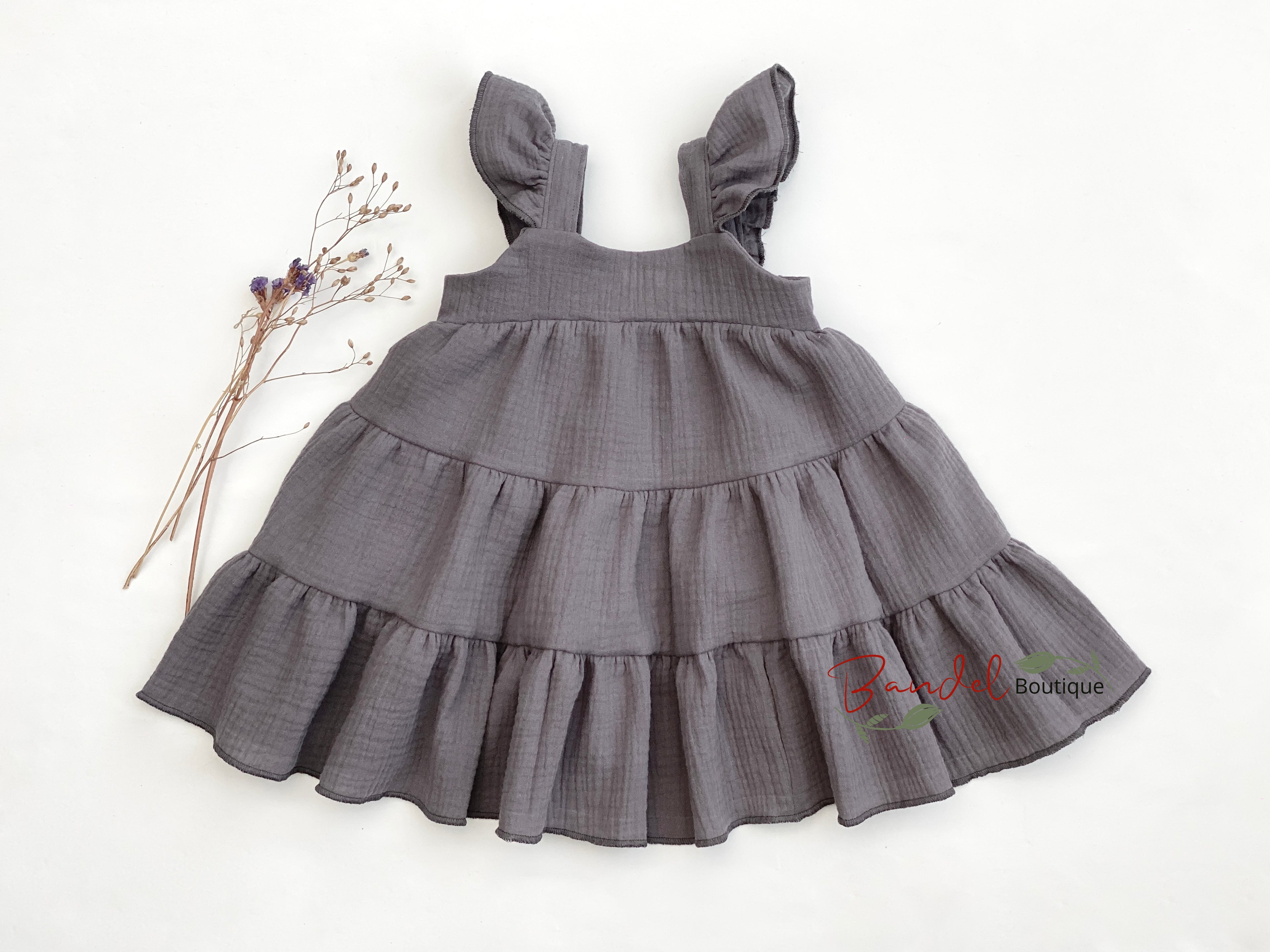 Gray tiered dress on a white background with 'Peachy Boutique' branding.