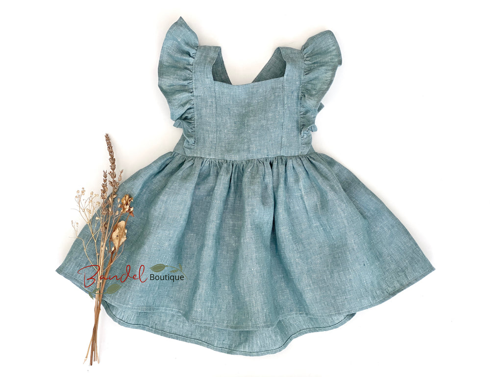 Mint- green dress with ruffled straps on a white background